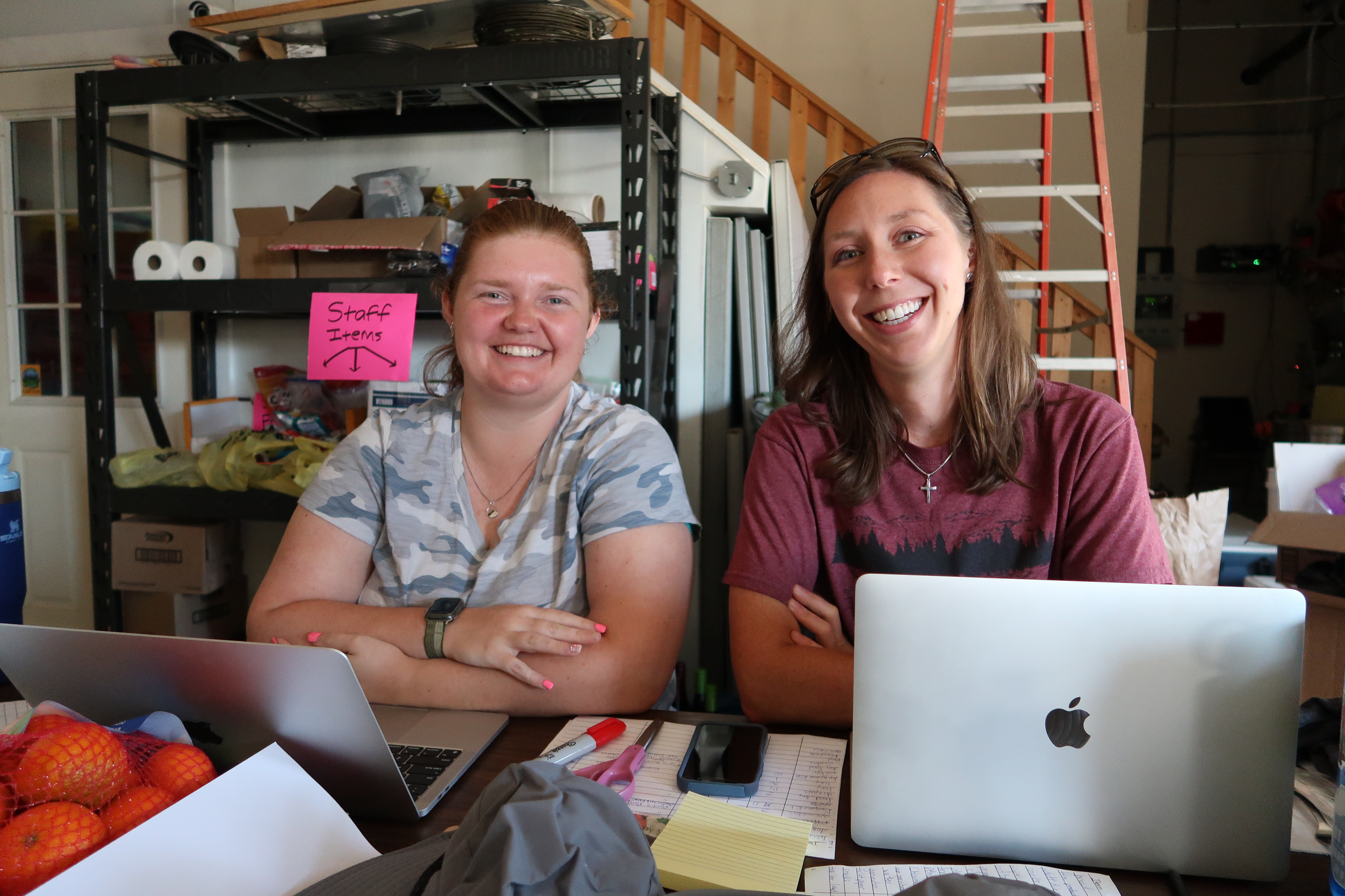 Two women at a desk and computer