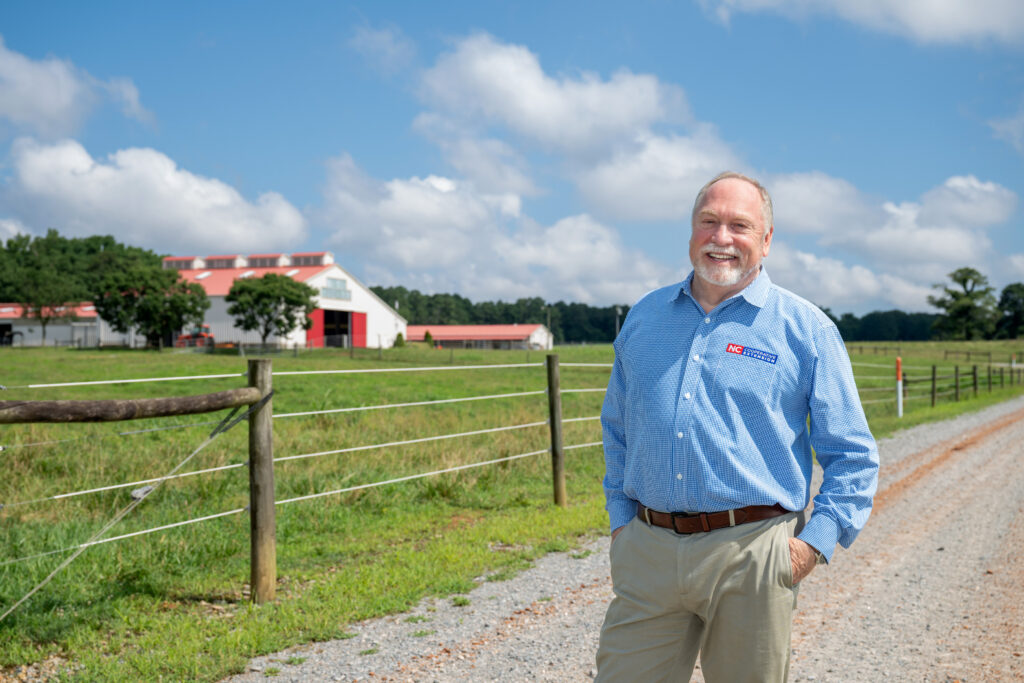 NC State Extension Director David Monks stands along the road at the university's Lake Wheeler Road Field Lab in Raleigh, North Carolina.